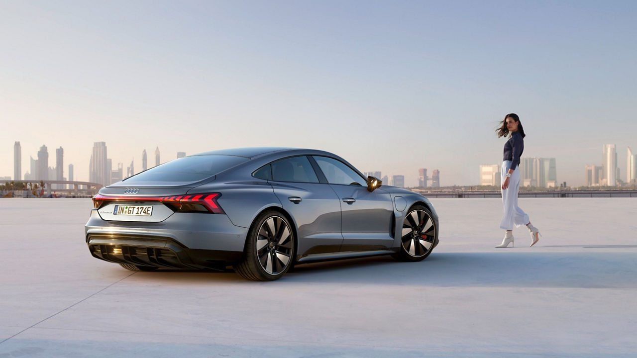  Audi car on a bright day with city skyline in the background